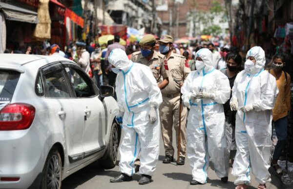 607941f4698f1 607941f4698f2health workers wearing ppe along with police personnel during a covid 19 awareness campaign at a market in jammu 3.jpg 990x640 1