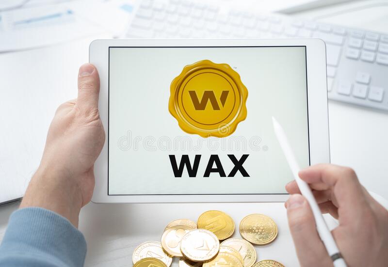 russia moscow man holding tablet logo token cryptocurrency wax crypto coin mining online game gaming platforms 219578457