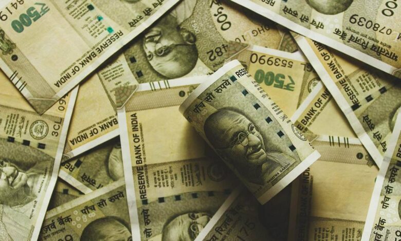 rupee hits record low of 80 to a dollar as global equity slump hammers currencies.