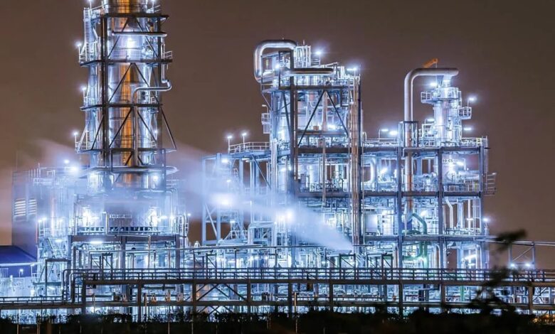 petrochemical plant distillation towers twilight damage gasoline