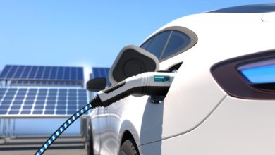 istock 1372085619 hidden costs of owning an electric car vehicle charging by solar panels