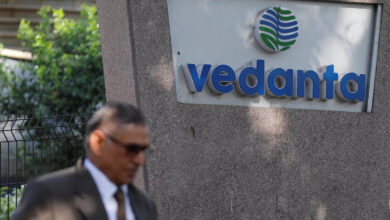 file photo a man walks past the logo of vedanta outside its headquarters in mumbai